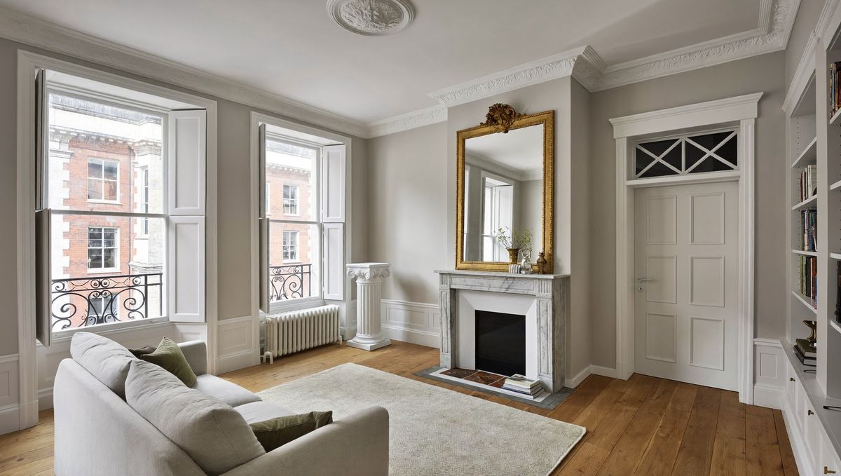 Generated illustration: a clean living room with sash windows in a London period conversion.